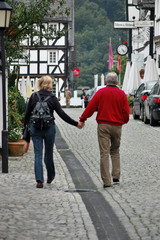   old couple  walking on the street
