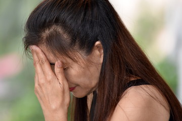 Fototapeta premium A Depressed Filipina Grandma