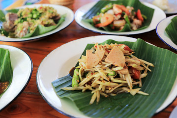 Spicy papaya salad with vietnamese pork sausage Thai traditional food “Som Tum Moo Yor”