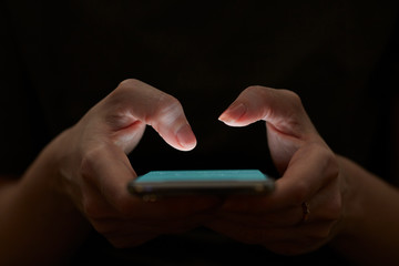 Holding hand on mobile phone