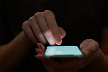 Holding hand on mobile phone