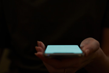 Holding hand on mobile phone