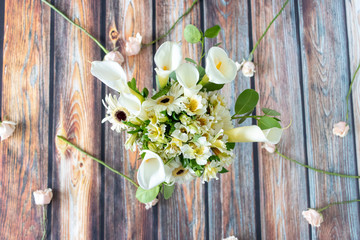 Floral arrangement of callas lilly and gerberas