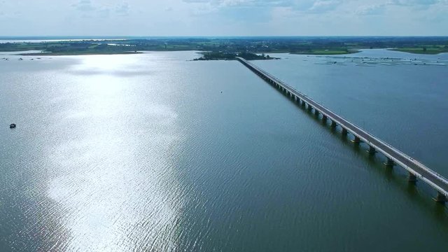 Aerial view Thepsuda Bridge over Lampao Reservoir.Thep Sada Bridge the Deja Vu Bridge is a 2-lane reinforced concrete bridge across Lam Pao Dam at Kalasin,Thailand.