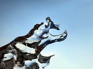Abstract ice crystal formation against sun light and dark blue sky background with copy space