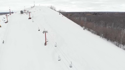 Snow park in Wisconsin, winter activities (tubing, skiing, snowboarding). Drone shots , bird's eyes view