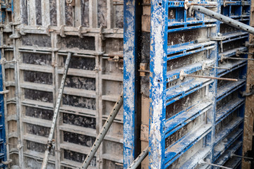 Fototapeta na wymiar construction of the building, concrete pouring of metal reinforcement cages of foundations