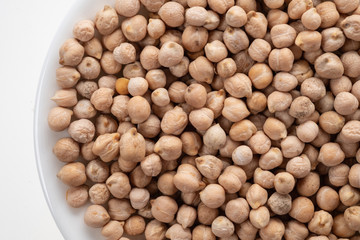 Peeled chickpea beans close-up on a white background