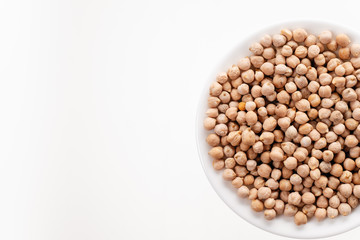 Peeled chickpea beans close-up on a white background with space for text