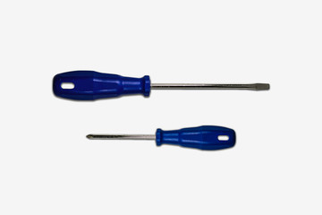 Screwdriver on soft gray background.High resolution photo.