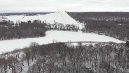 Snow park in Wisconsin, winter activities (tubing, skiing, snowboarding). Drone shots , bird's eyes view