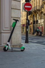 scooter kicksharing on the sidewalk.