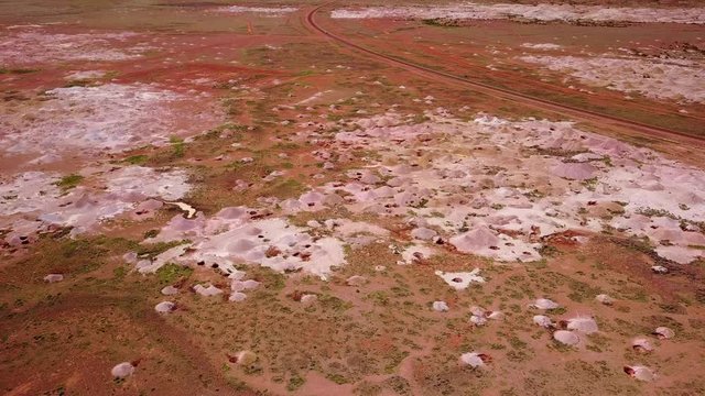 Aerial drone shot of opal mines and mining tailings in the desert outback of Coober Pedy Australia.