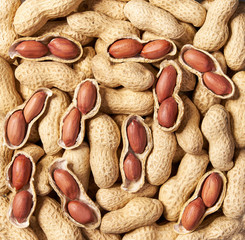Shelled and unshelled peanut   background close-up. Top view.