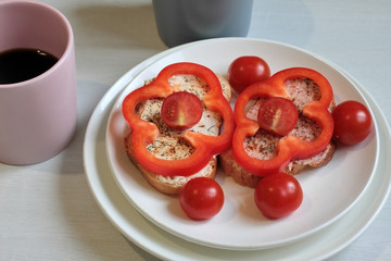 Breakfast sandwiches and coffee on the table