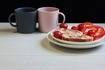 Breakfast sandwiches and coffee on the table