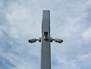 Fototapeta na wymiar Security Camera in the sky above the city park