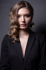 Portrait of a beautiful woman in a black jacket.