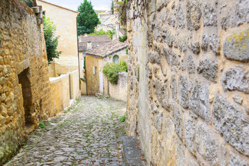 Fototapeta na wymiar 05.09.2017. Saint-Émilion, FRANCE. Saint-Émilion village - UNESCO World Heritage Site with fascinating Romanesque churches and ruins stretching all along steep and narrow streets.