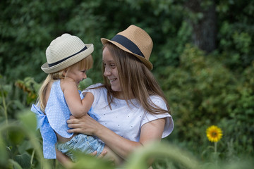 Teenager girl playing with her little sister.