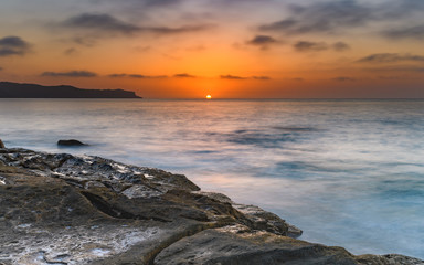 Fototapeta premium Sun Rising Over the Sea