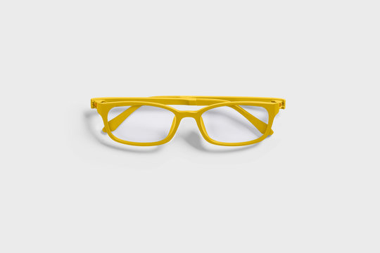 Yellow glasses isolated on soft gray background.