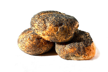 Several buns of wheat flour with poppy seeds. Isolated. Close up. Buns for a breakfast, filling, dessert