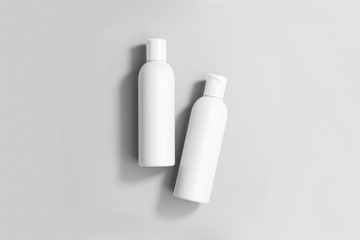 Cosmetic glossy plastic Bottles for shampoo, shower gel, lotion, body milk, bath foam isolated on...