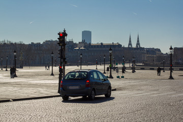 car in an empty square in paris in the afternoon