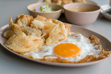 Roti is eaten with fried eggs as a Muslim breakfast.