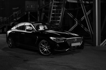 Four-door sport coupe. Silhouette of black sports car with headlights