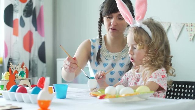 Mother and Daughter Preparing for Easter