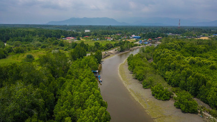 Fototapeta na wymiar Aerial view of the fishermen village in Kuala Spetang Malaysia. A view boat from above taking by drone
