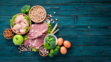 Balanced diet food background. Protein foods On a blue wooden background. Free space for your text.
