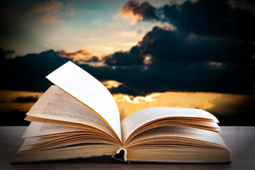 books on the background of thunderclouds