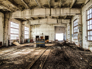 Old abandoned industrial building. Wet, mold damaged, dilapidated reinforced concrete building...