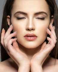 Portrait of beautiful young brunette woman with clean face.