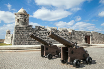 Fototapeta na wymiar Havana, Cuba - 22 January 2013: A fortress with very old cannons in the foreground