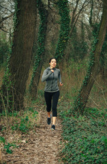 Young beautiful woman exercise in the forest
