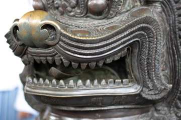 Lion cast by bronze in Wat Phra Kaew or name officially as Wat Phra Si Rattana Satsadaram