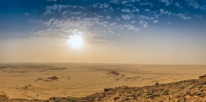 Recording of the holy mountain Jebel Bakal on the desert with the pyramids and the sun shining from the sky, Sudan