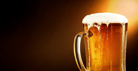 Cold beer and brown background with shadow 