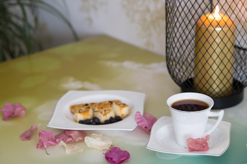 A cup of coffee,service cake in the plate and tea for concept.