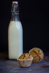 Homemade rye bread and fresh milk, low key, selective focus and toned image