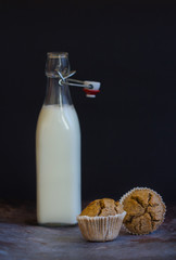 Homemade rye bread and fresh milk, low key, selective focus and toned image