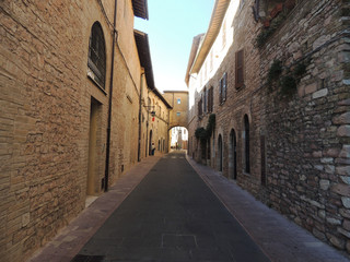 Fototapeta na wymiar Alley with ancient buildings in Assisi, Umbria, Italy.