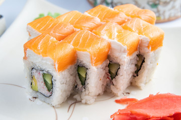 Sushi platter isolated on white background. Japanese food restaurant delivery - maki california rolls big party set, top view