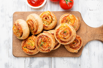 Fototapeta Rolls of puff pastry with bacon and cheese . obraz