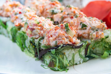 Sushi platter isolated on white background. Japanese food restaurant delivery - maki california rolls big party set, top view