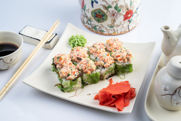 Sushi platter isolated on white background. Japanese food restaurant delivery - maki california rolls big party set, top view